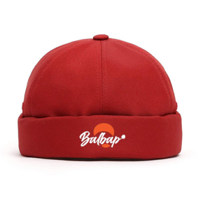 Oxblood round cap with orange and white logo